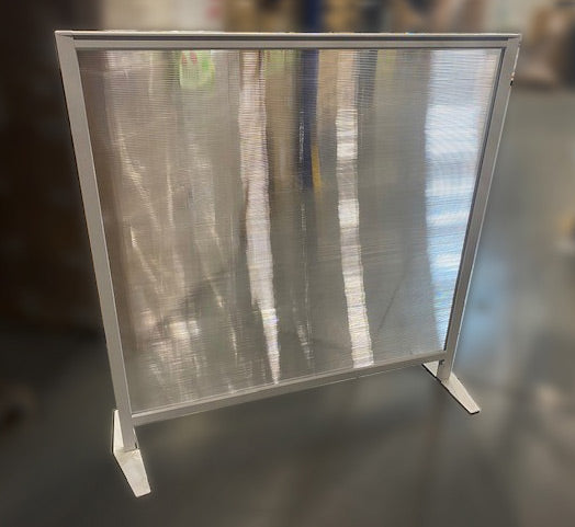 Freestanding textured acrylic panel in a silver frame with two stabilizer feet 