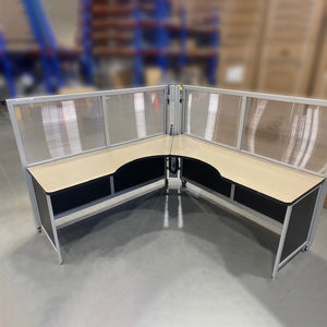 Mobile L-shaped workstation with surrounding semi-clear upper and coloured lower panels. Ash worksurface and black panels