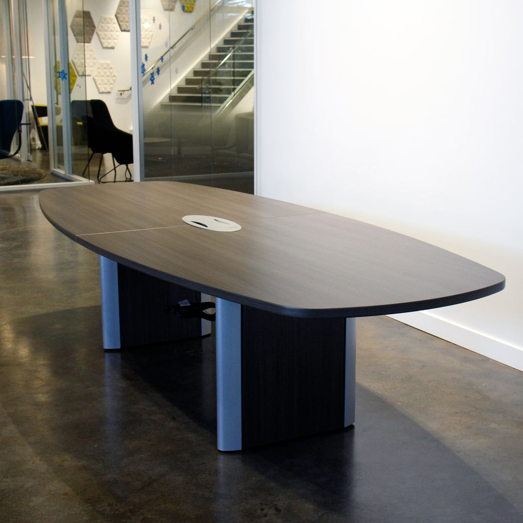 Teknion convex conference table with flip up power module