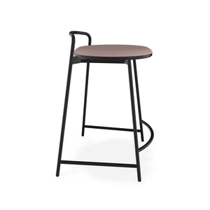 Side view of Teknion North 56 Chez counter stool in black metal frame and blush upholstered seat