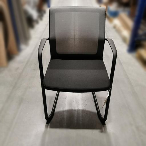 Front view of black Teknion Projek guest chair with cantilever base